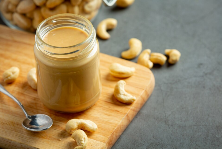 How to Make Vegan Butter - Container of homemade cashews paste.